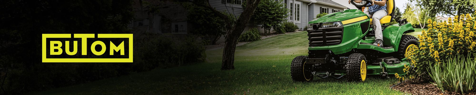 Butom logo over a lawn tractor on a freshly cut lawn